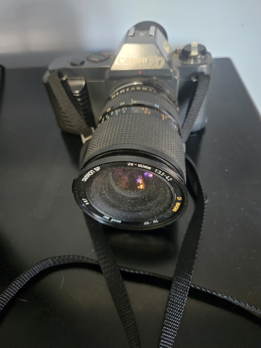Canon T50 35mm SLR Camera with Black Zoom Lens